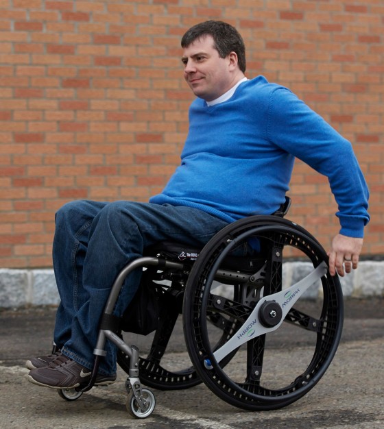 man-rolling-with-foldable-wheelchair-wheels-e1381319758303